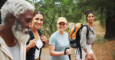 Buy stock photo Fitness, smile and people in nature for hiking, explore environment or journey on trail. Trekking group, man guide and walking in forest for exercise, explain route or outdoor for wellness activity
