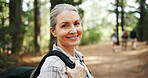 Hiking, forest and portrait of mature woman in nature with backpack for exercise, workout and walking. Fitness, travel and person in woods for trekking, adventure and journey outdoor for wellness