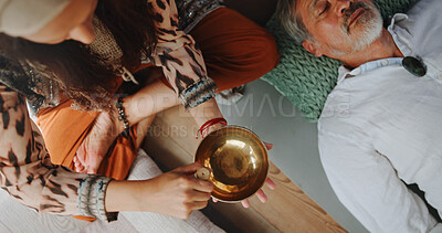 Buy stock photo Tibetan bowl, relax and hands of person in studio for wellness retreat, healing and meditation. Chakra balance, peace and sound therapy with above of shaman for energy, holistic ritual and harmony