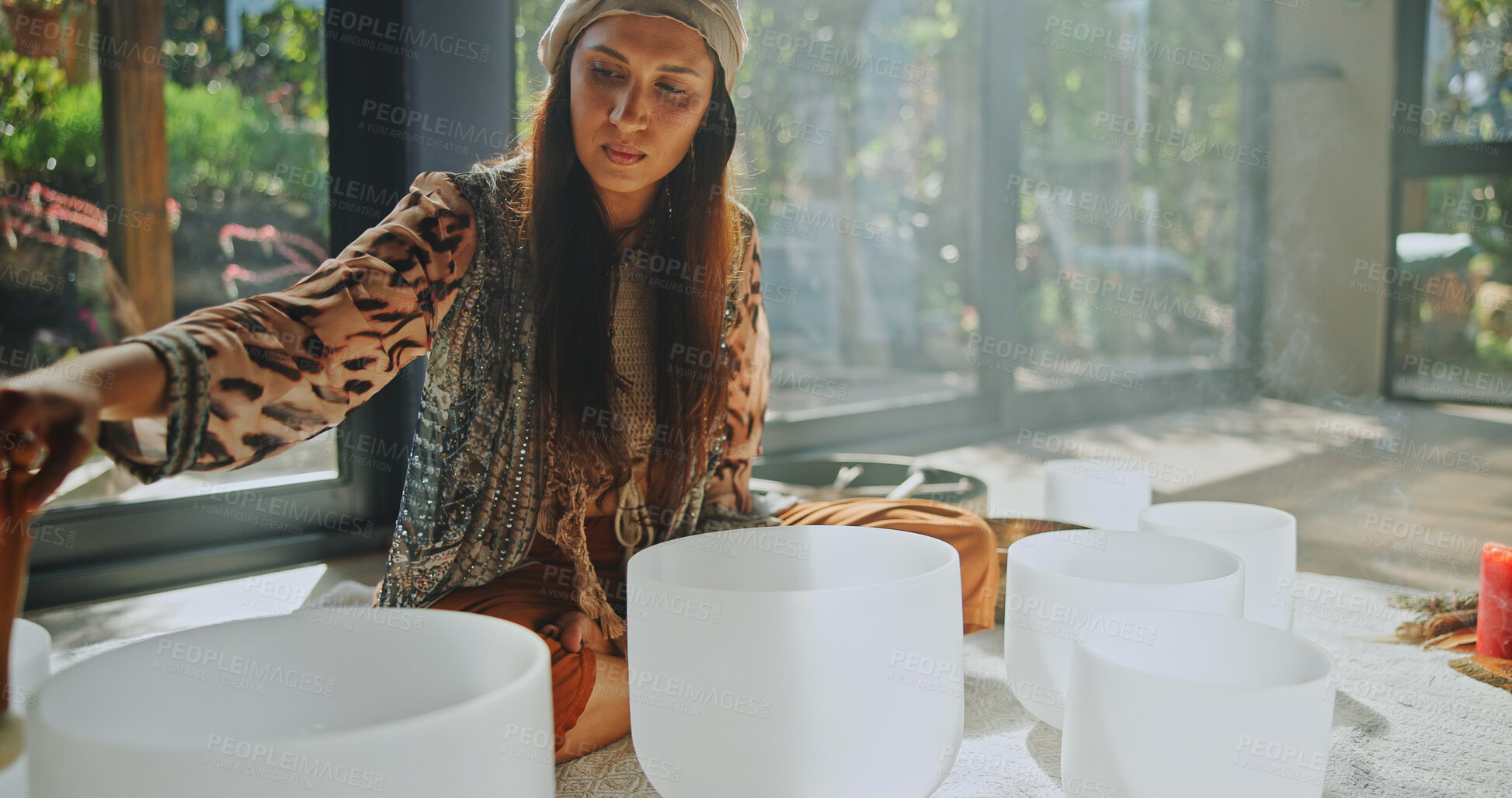 Buy stock photo Natural healing, woman and bowls with naturopath for Buddhism, ceremony and meditation in studio. Female healer, sandalwood and sound therapy for spirituality with incense or alternative medicine
