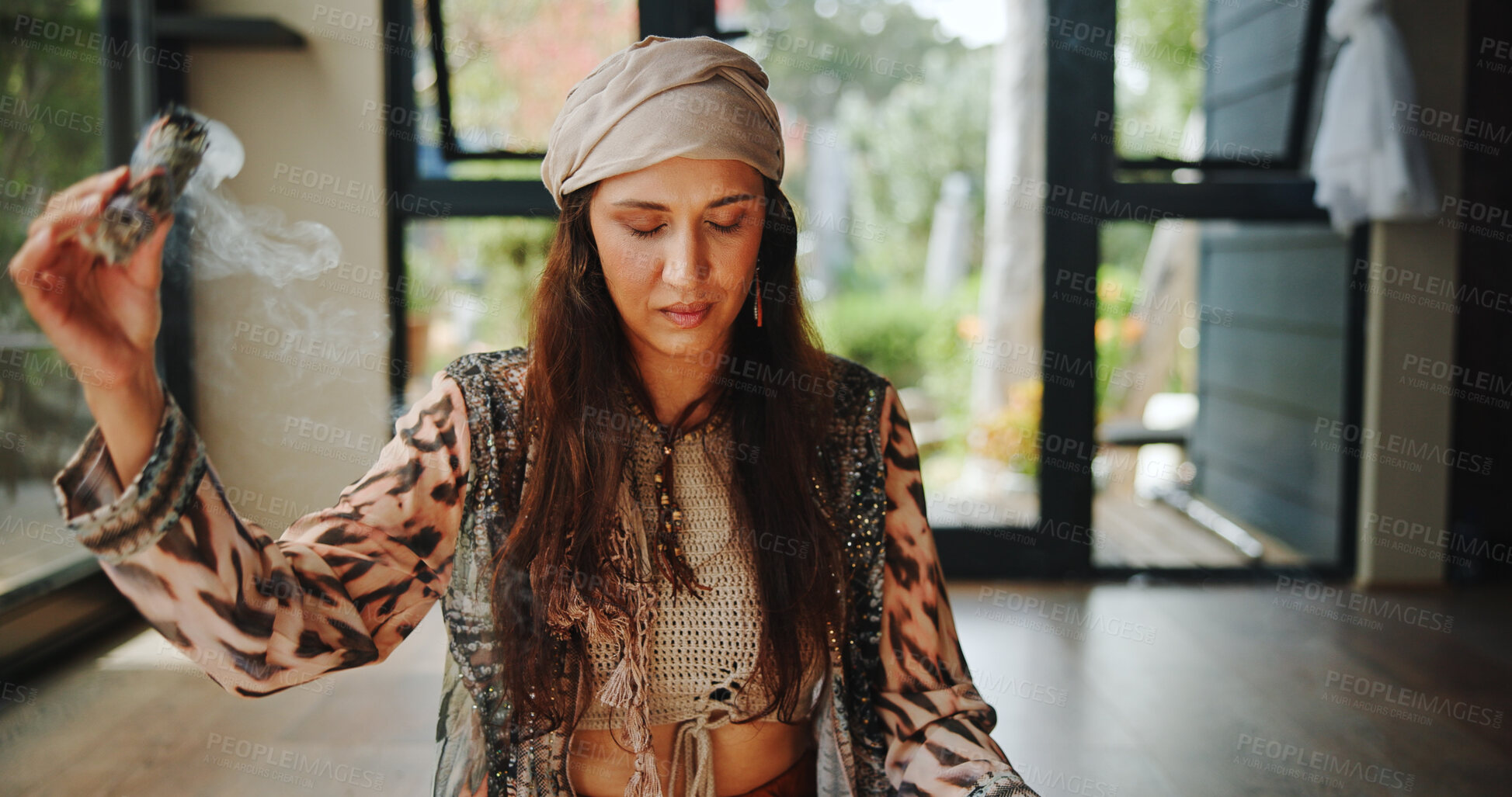 Buy stock photo Smudging, woman and sage with smoke, sacred and burning herb for purification and indigenous tradition. Chakra, spiritual and person with Salvia apiana for prayer, morning and ritual for inner peace