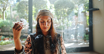 Buy stock photo Spiritual, woman and sage with smoke, smudging and burning herb for purification or indigenous tradition. Chakra, cleansing and person with Salvia apiana for prayer, morning or ritual for inner peace