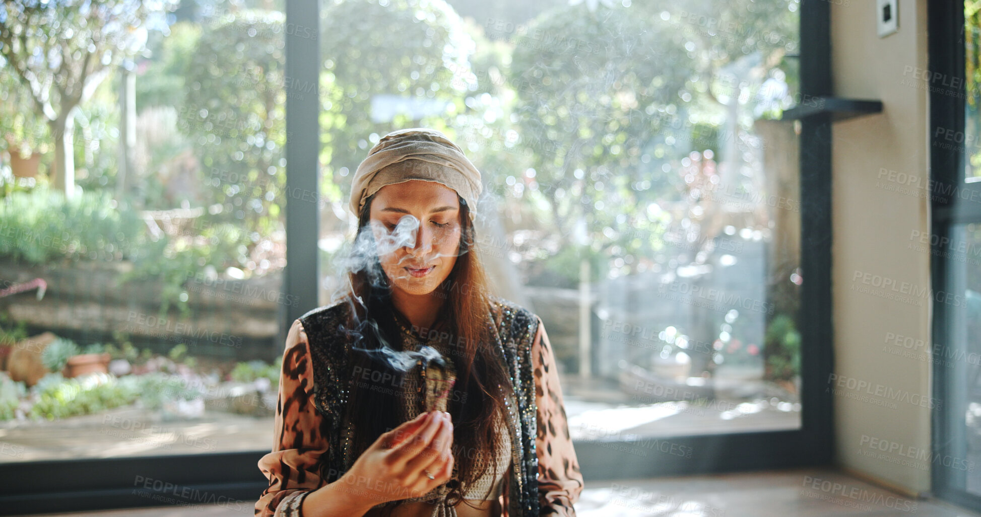 Buy stock photo Woman, natural healing and incense with naturopath for Buddhism, ceremony and culture in studio. Healer, sage smoke and aromatherapy for spirituality with chakra clean or alternative medicine