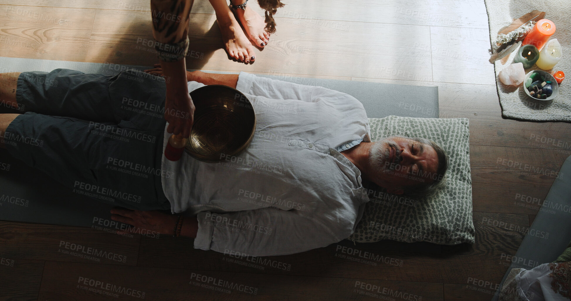 Buy stock photo Hands, person and bowl for Tibetan singing with man for healing, sound ritual and holistic practice. Healer, soul music and metal instrument of natural meditation, spiritual mantra and chakra balance