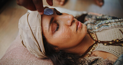 Buy stock photo Woman, crystal and forehead with hands for chakra on floor, energy and therapy with rest on vacation. People, rocks and holistic care with mineral, mindfulness or peace for zen with balance at resort