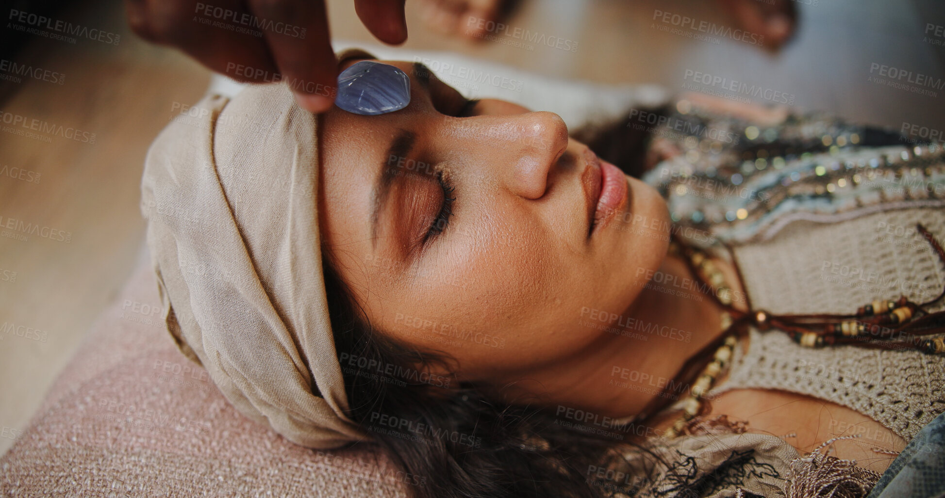 Buy stock photo Woman, crystal and forehead with hands for chakra on floor, energy and therapy with rest on vacation. People, rocks and holistic care with mineral, mindfulness or peace for zen with balance at resort
