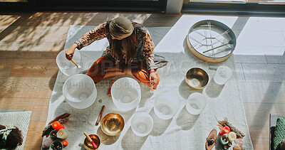 Buy stock photo Woman, singing bowl and sound on floor for therapy, frequency or peace with mindfulness at studio. Person, shaman and above with guide in class, crystal or zen for chakra balance for holistic healing