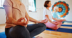 Hands, lotus and women with group meditation for calm mindset, zen or peace in mental wellness. Posture, morning and people in class together for mindfulness, relax or holistic self care on yoga mat