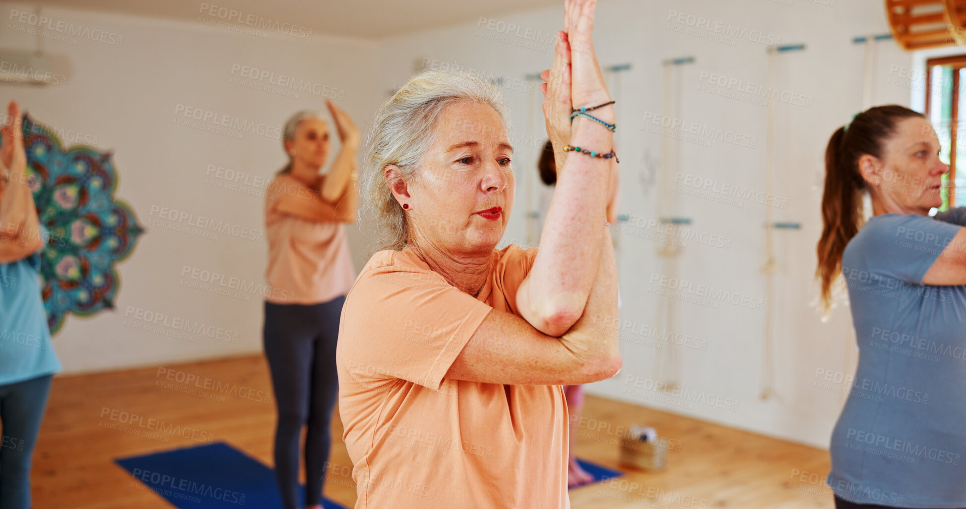 Buy stock photo Yoga class, elderly women and fitness with exercise, spiritual wellness and pilates with balance. Senior people, retirement and group in health club, calm and stretching with energy and warm up