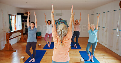 Buy stock photo Women, instructor and yoga with class for zen, pilates or stretching together on mat. Female people, teacher or coach with yogi group for holistic training, spiritual wellness or balance in studio