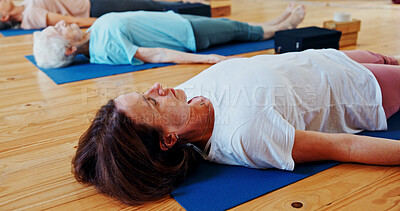 Buy stock photo Relax, meditation and woman in class for calm, wellness and mindfulness with inner peace. Self care, health and mature female person with breathing on yoga mat for holistic healing, zen or balance.