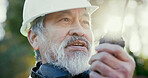 Building, radio and thinking with developer man outdoor on excavation site as construction worker. Communication, development and update with person talking for architecture, engineering or planning