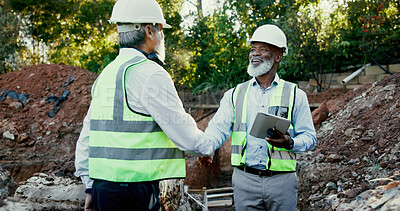 Buy stock photo Construction site, contractor and handshake people for partnership outdoor for development. Mature men, tablet or engineers for excavation, agreement or collaboration and shaking hands for deal