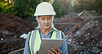 Building, excavation and tablet with construction worker woman on site for development or planning. Architecture, blueprints and hardhat with mature developer outdoor for industrial engineering