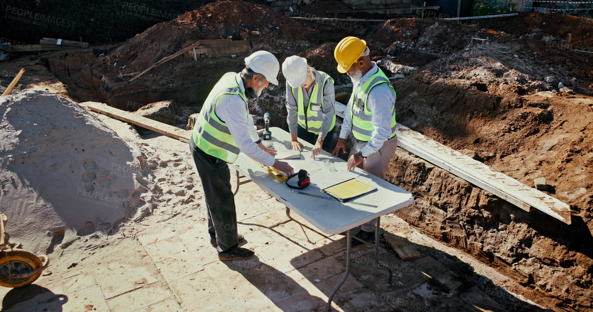 Buy stock photo Above, people and team on construction site for planning, check blueprint and engineering collaboration. Architect group, building layout and outdoor in meeting for brainstorming, compliance and PPE