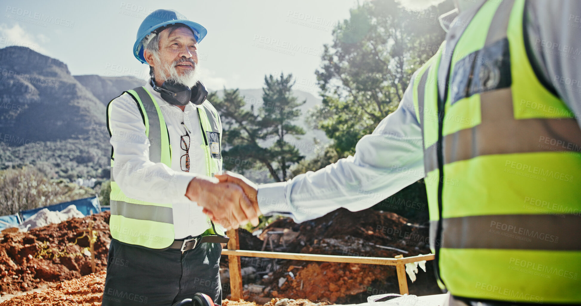 Buy stock photo Construction worker, partnership and people shaking hands outdoor for agreement on development deal. Mature man, builder or engineers together for excavation, contract or collaboration with handshake
