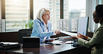 Women, documents and discussion with finance at office, review and feedback with charts by computer. Mature mentor, accounting and business people with paperwork, inspection and planning at agency