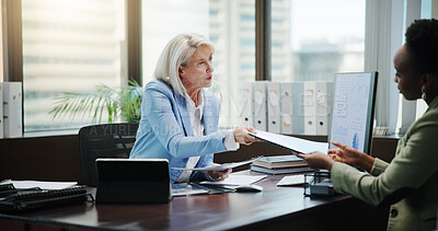Buy stock photo Women, documents and discussion with finance at office, review and feedback with charts by computer. Mature mentor, accounting and business people with paperwork, inspection and planning at agency