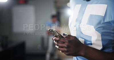 Buy stock photo Football, phone and hands of man in locker room for rookie drafting, pro league research and contact. Game score update, team roster with closeup of person for connection, training schedule and web