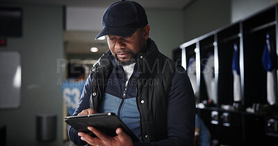 Buy stock photo Tablet, coaching and black man with football strategy in locker room for game plan or defense formation. Touchdown tactics, sports and manager with technology, match feedback and training analysis