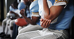 Elbow pain, hand and football player in locker room for fitness accident, fibromyalgia or fracture. Arm, hurt and inflammation with man, health issue with tension or pressure of sports injury