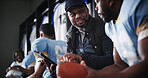 Black men, coach and football captain on tablet in locker room for game plan, strategy and layout. African mentor, athlete and sports trainer on technology for brainstorming match and play routine