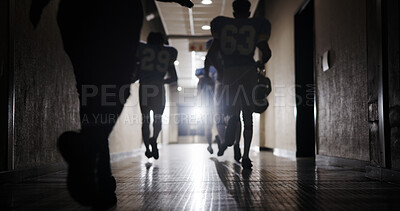 Buy stock photo Light, football and walking and team in corridor for sports competition, stadium match and game. Fitness, pro league player and athlete with people in tunnel for training, tournament and contest
