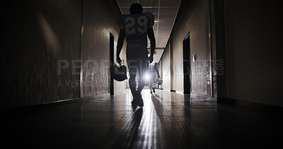 Buy stock photo Back, football and walking with man in corridor for sports competition, stadium match and game. Fitness, pro league player and athlete with person in tunnel for training, tournament and contest