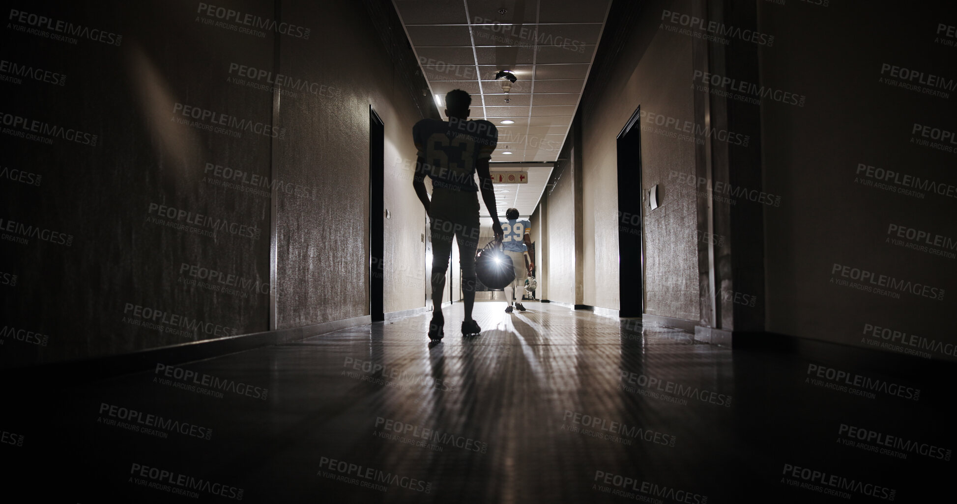 Buy stock photo Back, football and walking with man in stadium corridor for sports competition, match and game. Fitness, pro league player and athlete with person in tunnel for training, tournament and contest