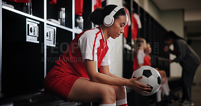 Buy stock photo Thinking, soccer ball and woman with headphones for music, audio and radio for training. Relax, sports and person listening to track for exercise, practice and workout for match, game and tournament