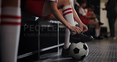 Buy stock photo Soccer, foot and tying shoes with ball in locker room for sport preparation, competition or tournament. Person, legs or professional football player getting ready with tie sneakers for game or match