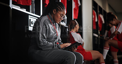 Buy stock photo Woman, soccer coach and schedule with tablet for game time, matchup or attendance list in locker room. Female person, manager or coordinator with technology or app for fixtures or player registration