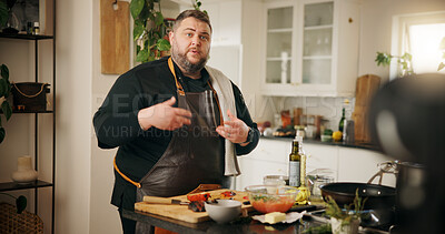 Buy stock photo Vlog, cooking and man with live streaming in kitchen for dinner menu tutorial, meal prep or video recording. Food influencer, content creation or person with culinary skills or nutrition tips in home