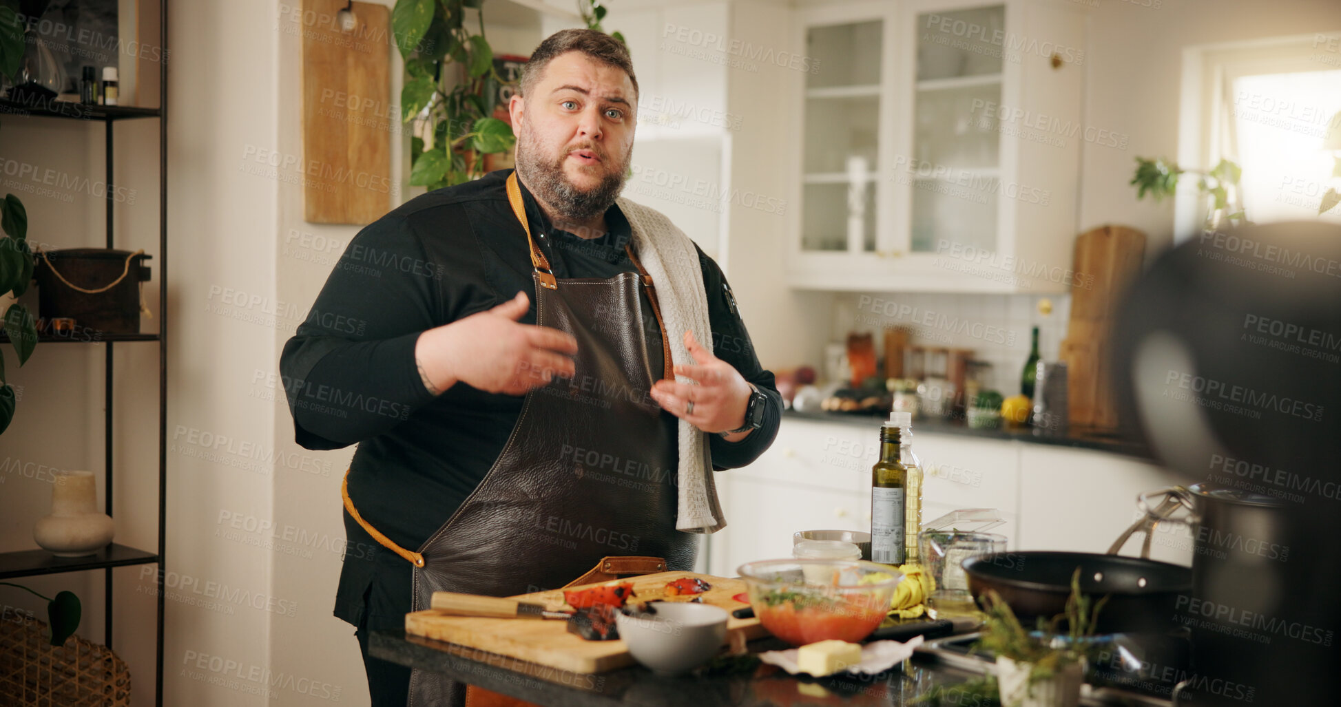 Buy stock photo Vlog, cooking and man with live streaming in kitchen for dinner menu tutorial, meal prep or video recording. Food influencer, content creation or person with culinary skills or nutrition tips in home