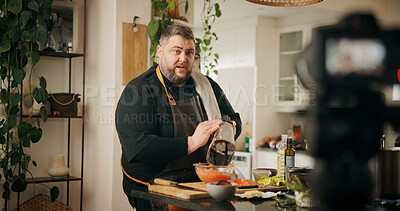 Buy stock photo Ingredients, cooking and man with live streaming in kitchen for dinner recipe, meal prep or video recording. Culinary influencer, content creation or person with cuisine tutorial or nutrition in home