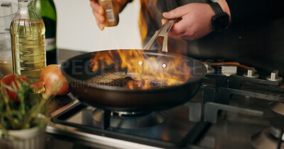 Buy stock photo Cooking, flame and man with hands, frying pan and flambe expert with food, dinner and ingredients. Closeup, person and chef with utensils, home and meal prep with nutrition, culinary skills or heat