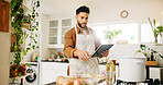 Man, tablet and ingredients with kitchen, recipe and home for internet instructions and cooking food. Technology, blog and preparation with chef person in apartment for diet, health or nutrition