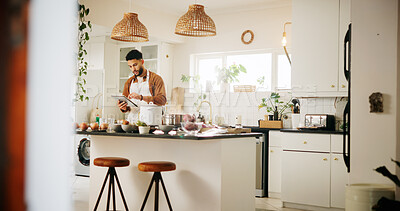 Buy stock photo Man, tablet and preparation with kitchen, recipe and home with food ingredients and internet instructions. Technology, blog and cooking with chef person in apartment for diet, health or nutrition