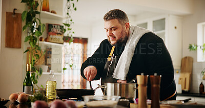 Buy stock photo Home, man and chef in kitchen for cooking, culinary skills and ingredients on counter for dinner. House, male person and cook with experience for meal prep, gourmet cuisine and food in pan on stove