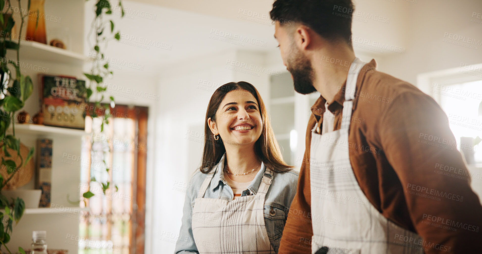 Buy stock photo Talking, cooking and couple in kitchen in house together for bonding, conversation and connection. Happy, helping and man with woman for preparing meal, food or dinner for health diet in apartment.