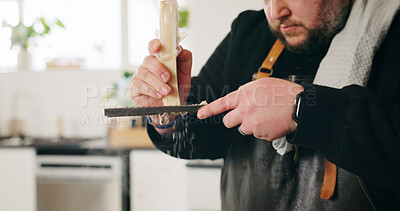 Buy stock photo Food, cheese and hands of man with grater in house kitchen for diet, private service or nutrition. Ingredients, cooking recipe or personal chef with parmesan for gourmet cuisine, hospitality or lunch