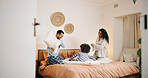 Happy family, bed and playing with pillow fight for fun bonding, game or holiday together at home. Dad, mom and playful child enjoying weekend or bedroom war with soft cushion in pajamas at house
