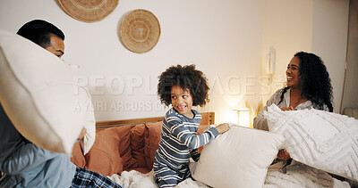 Buy stock photo Happy family, bedroom or playing with pillow fight for fun bonding, game or holiday together at home. Dad, mom and playful child enjoying weekend, activity or cushion war with pajamas in bed at house