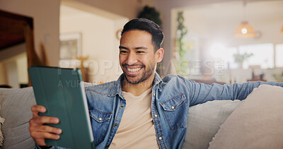 Buy stock photo Home, sofa and man with tablet for laughing, streaming online and entertainment with comedy show. House, lounge and male person with digital for application, funny video and happy on social media