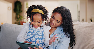 Buy stock photo Mother, child and tablet in home for learning, storytelling or reading ebook together. Girl, kid and parent with technology on sofa for education, teaching or play game on internet with happy family