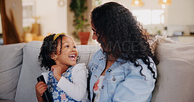 Buy stock photo Mom, girl and laugh for watching tv on sofa with remote control for movie, choice or bonding with love. Child, mother and daughter with smile, care or relax on couch for streaming film in family home