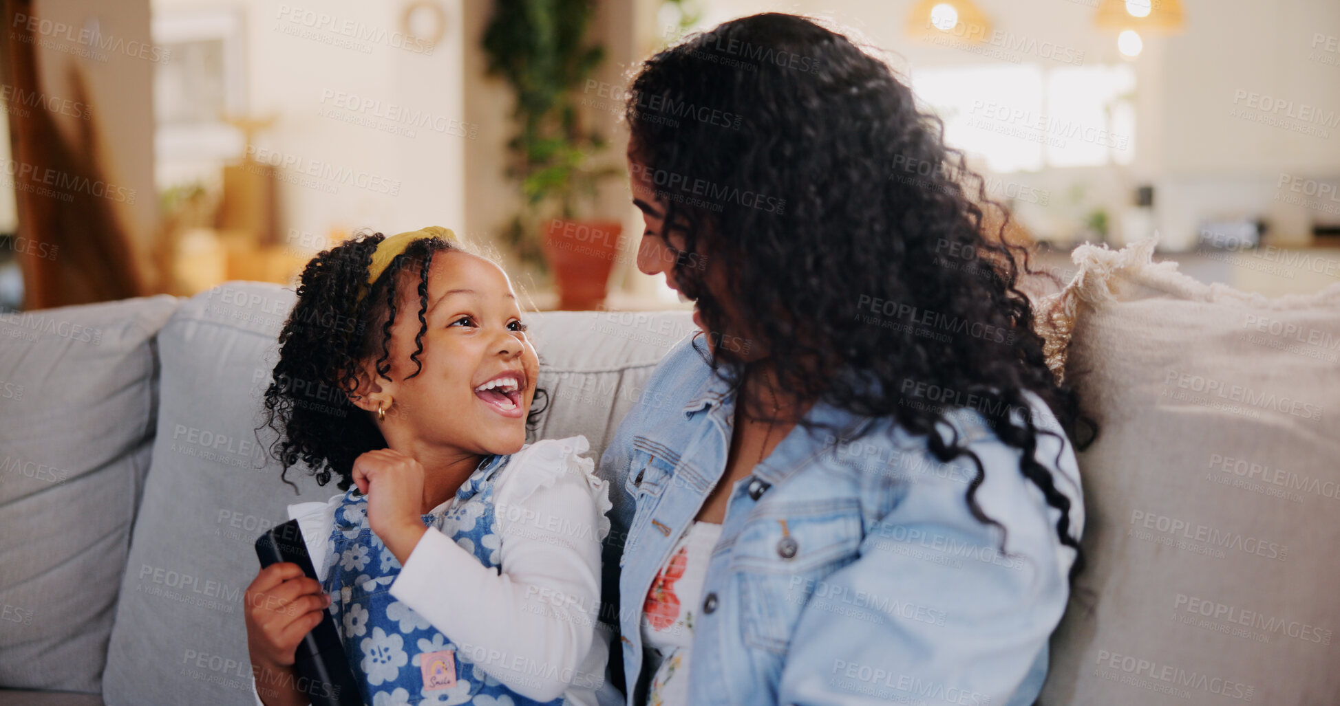 Buy stock photo Mom, girl and laugh for watching tv on sofa with remote control for movie, choice or bonding with love. Child, mother and daughter with smile, care or relax on couch for streaming film in family home