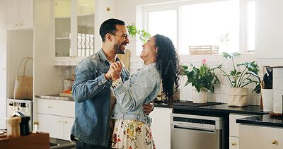 Buy stock photo People, couple and laugh with dancing in kitchen for anniversary celebration, bonding and fun. Man, woman and relationship with smile as newlyweds at home for care, support and trust with music