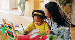 Happy, mom and helping child with homework, writing and smile for assignment, growth and development. House, woman and bonding with daughter with notebook, education or knowledge for girl with abacus