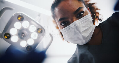 Buy stock photo Face mask, woman and dentist with tools for surgery, oral health and dental hygiene below with light. Person, portrait and orthodontics for clean tooth, medical procedure and root canal in clinic
